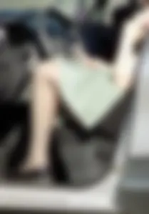 Sexy chick with hot legs in pantyhose wearing a short dress sitting in her car creepshots