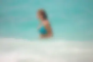 Assortment of sexy babes at the beach in bikinis