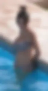 Sexy pool teen with big boobs barely staying in her top
