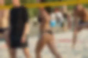 Hot Tattooed Girl in Black Swimsuit Playing Volleyball on the Beach Creepshot Photos Gallery