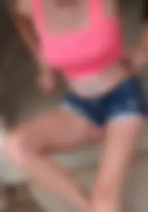 Friend in short shorts showing cheeks and some cleavage