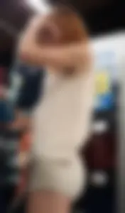Redhead hottie in shorts shopping with a nice ass