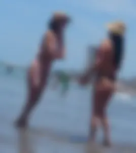 2 milfs in thong bikinis on the beach
