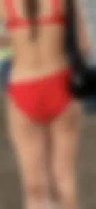 Beauty picks at her bikini wedgie