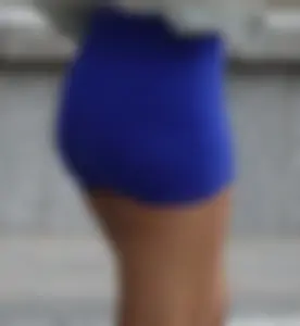 Mixed race woman in spandex shorts outfit