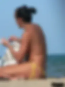 Bunch of sexy babes on the beach topless and in thong bikinis