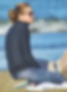 Beach redhead milf in patterened leggings at the beach