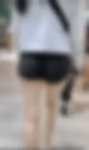 Asian girl in tight black shorts at the mall