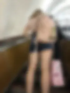Candid Girl in Denim Shorts and Sneakers Standing on the Escalator - Hot Legs Closeups