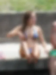 Sexy girl at the pool in a bikini with great tits
