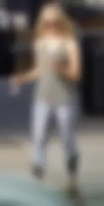Hot blonde in light leggings after getting Starbucks