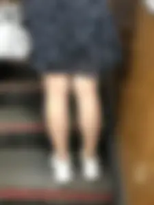 Redhead canidd milf wearing a dress on a subway escalator, hot legs