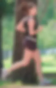 Cute girl running in short shorts
