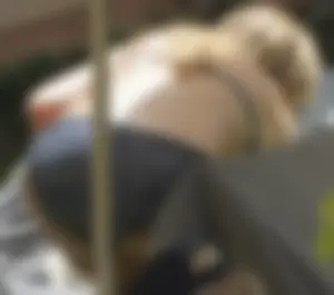 Skinny girl laying out in her bikini has pussy lip slip