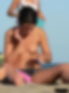 Sexy girls going topless at the beach showing off their sexy bodies