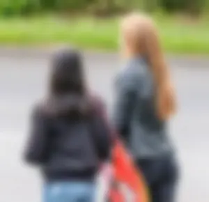 Redhead and ethnic skinny teens in tight jeans