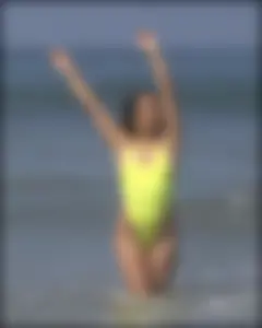 Sexy ass beach babe in a yellow thong swimsuit