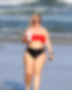Thick BBW blonde lady in a bikini at the beach