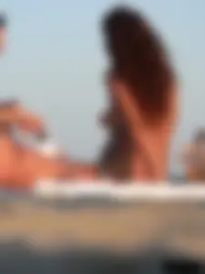 Sexy girls going topless at the beach showing off their sexy bodies