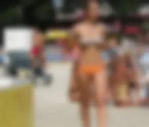 Sexy bikini girl with nice camel toe in orange bikini bottom
