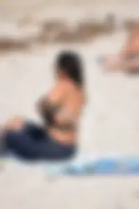 Thick mature brunette bikini lady on the beach with a nice body