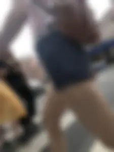 Young Girl in Shorts And Sandals Crossing the Street Gallery