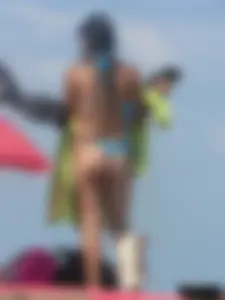 Couple of thick beach teens in little thong bikinis