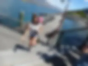 Pretty girl with a camera in little denim shorts