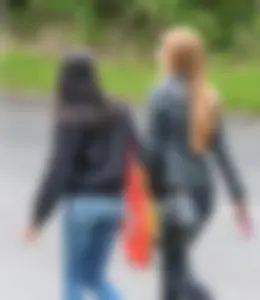 Redhead and ethnic skinny teens in tight jeans