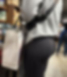 Closeup of a hot candid girl's bubble ass in yoga pants - wearing a grey hoodie at the supermarket
