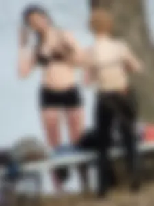 Two gorgeous candid girls secretly changing clothes in a park by a lake, some tits flashing going on, voyeur creepshots