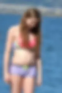 Beauty at the beach in booty short bikini