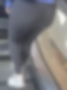 Girl with fit bubble booty in leggings going up elevator