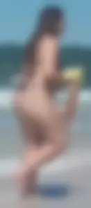 Fat ass milf at the beach in a thong bikini