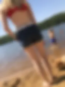 Skinny Barefoot Girl in Swimsuit and Shorts at the Beach Candid Photo Gallery