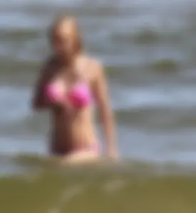 Two sexy beach teens in bikinis, one thick and one skinny with big boobs