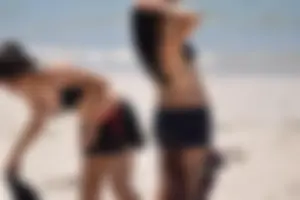 Beach girl can't keep her tits in her bikini