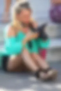 Blonde lady upskirted showing her panties and pussy lips