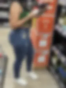 Sexy Latina buying wine