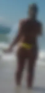 Big booty white chick in a yellow thong at the beach