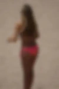 Beach volleyball babe with a nice ass in pink bikini bottom