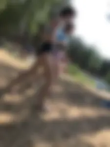 Wet Girls in Swimsuits Walking Towards Water at a Lake Beach Photo Series