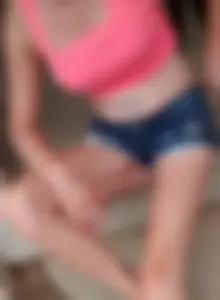 Friend in short shorts showing cheeks and some cleavage