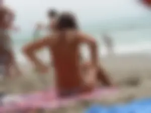 Hot topless girl on the beach in a thong bikini with a nice ass