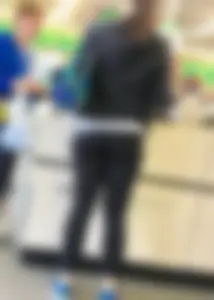 Thick booty girl shopping at Dollar Tree in leggings