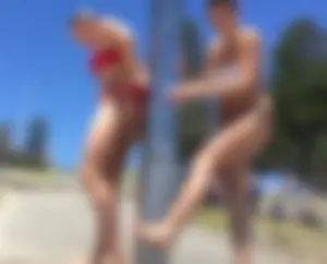 Hot girls taking shower at the beach