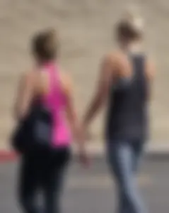Skinny blonde in grey leggings with a friend