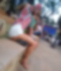 Leggy girl in shorts sitting