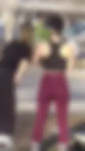 Sexy candid brunette babe with a nice booty in maroon leggings while rollerblading