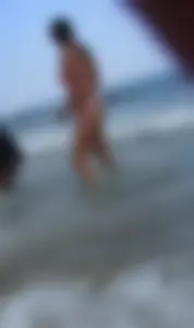 Pierced nipples hottie in pink at the beach